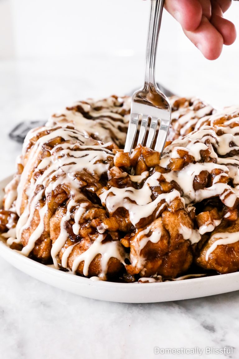 This Apple Cinnamon Monkey Bread is full of diced cinnamon apples and drizzled in a homemade cream cheese frosting.