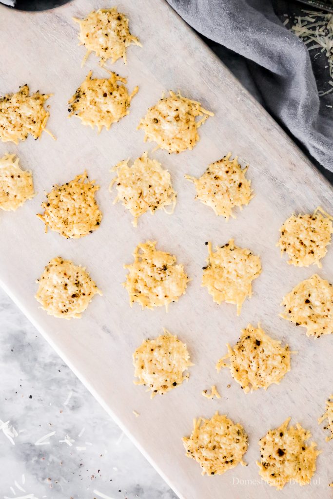 A two-ingredient recipe for Black Pepper Parmesan Crisps that are perfect for topping soup or salad or eating with dip!