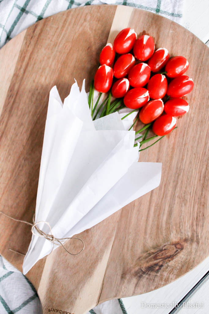 This Cherry Tomato Tulip Bouquet is a bright & beautiful way to create a vegetable platter for your next spring party or Easter brunch!