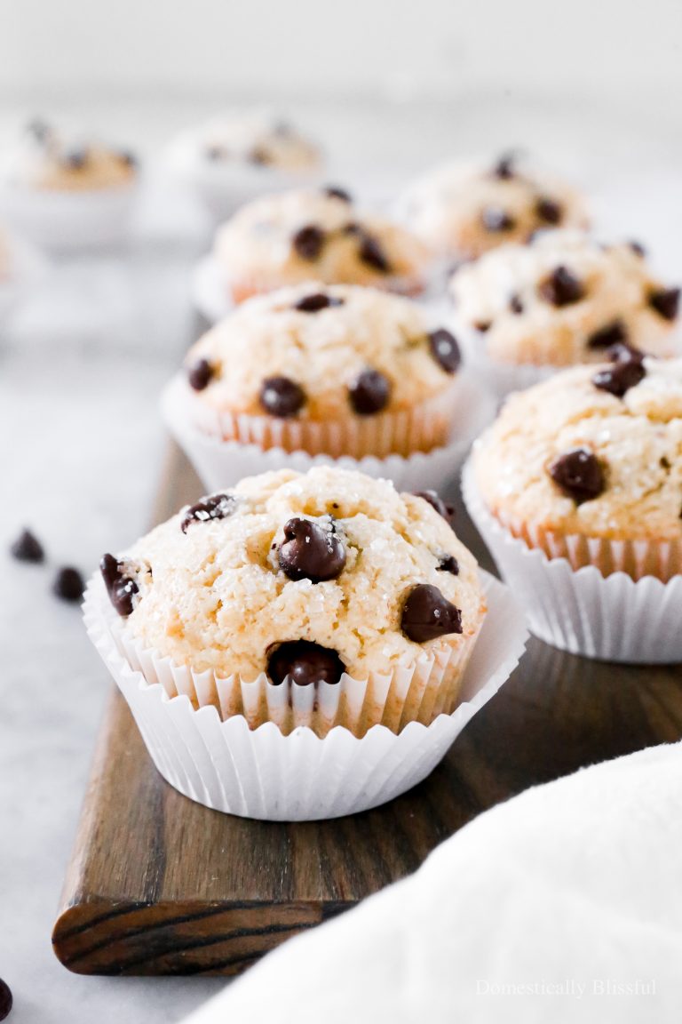 These Chocolate Chip Muffins have a secret ingredient and are topped with extra chocolate chips and glittery sugar.