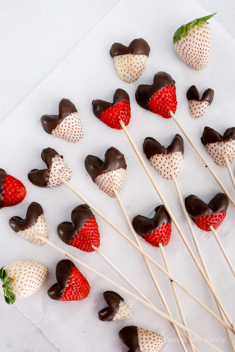 These Chocolate Dipped Pineberry Hearts and strawberries on skewers are perfect for a girl's night, a wedding shower, Valentine's Day, or anytime you want a special dark chocolate-dipped treat.