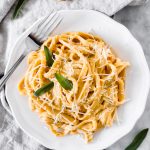 This Creamy Pumpkin Alfredo Fettuccine is a great use for leftover pure pumpkin and is a creamy fall dinner recipe your whole family will love!