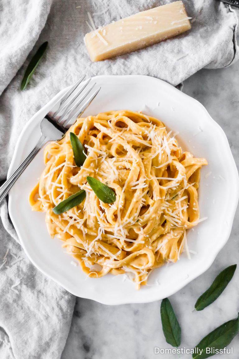 This Creamy Pumpkin Alfredo Fettuccine is a great use for leftover pure pumpkin and is a creamy fall dinner recipe your whole family will love!