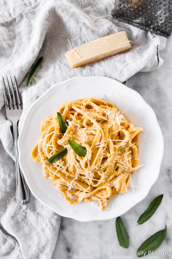 This Creamy Pumpkin Alfredo Fettuccine is a great use for leftover pure pumpkin and is a creamy fall dinner recipe your whole family will love!