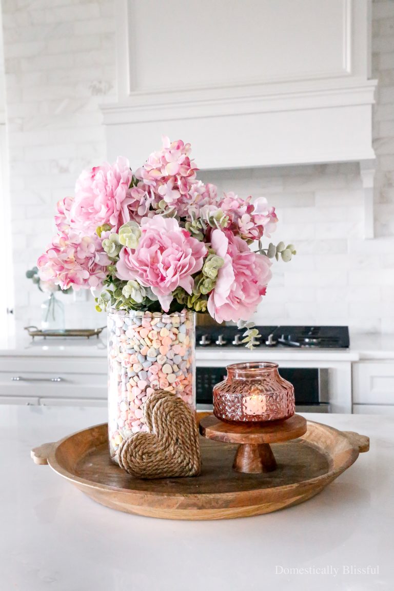 This DIY Candy Heart Centerpiece is a fun and easy way to decorate for Valentine's Day or a Galentine's Party.