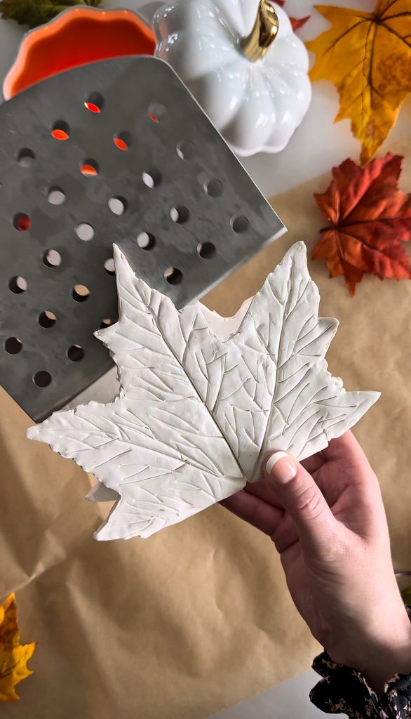 This DIY Clay Leaf Napkin Holder is a fun fall craft that makes a great gift and beautiful autumn decor for your kitchen.