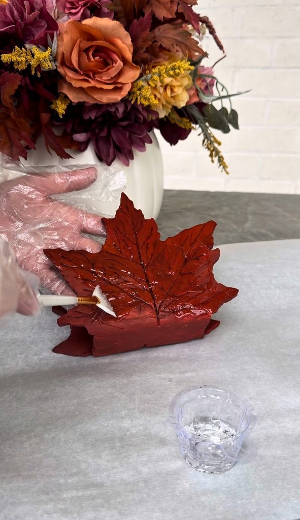 This DIY Clay Leaf Napkin Holder is a fun fall craft that makes a great gift and beautiful autumn decor for your kitchen.