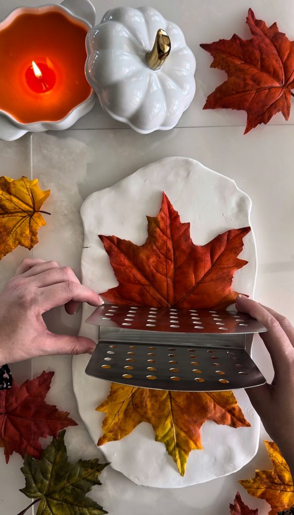 This DIY Clay Leaf Napkin Holder is a fun fall craft that makes a great gift and beautiful autumn decor for your kitchen.