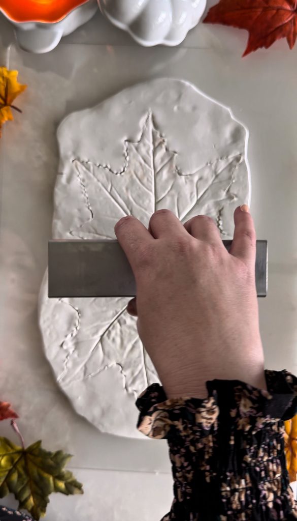 This DIY Clay Leaf Napkin Holder is a fun fall craft that makes a great gift and beautiful autumn decor for your kitchen.