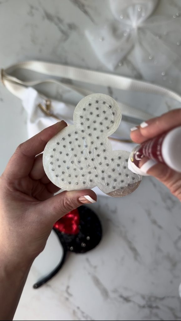 A DIY Disney Bag with a pearl Mickey Mouse patch to take on your next Disney World Vacation.
