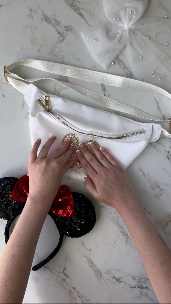 A DIY Disney Bag with a pearl Mickey Mouse patch to take on your next Disney World Vacation.