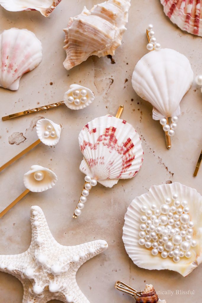 These DIY Seashell Hair Pins are a fun summer craft made with hair pins, seashells, and fake pearls.