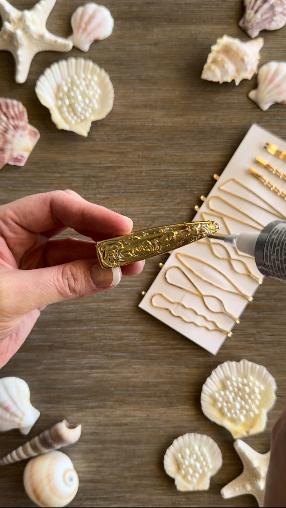 These DIY Seashell Hair Pins are a fun summer craft made with hair pins, seashells, and fake pearls.