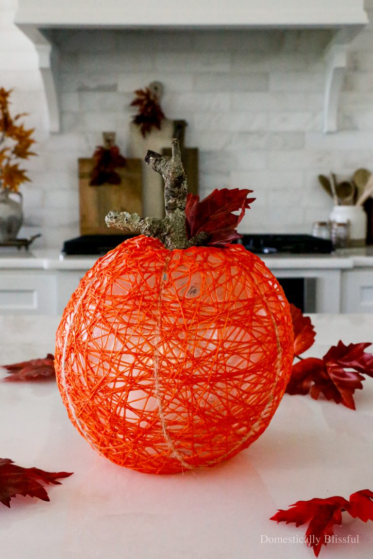 This DIY String Pumpkin Lantern is an easy fall craft and a fun way to light up the cooler evenings with a faux pumpkin and flameless candle.