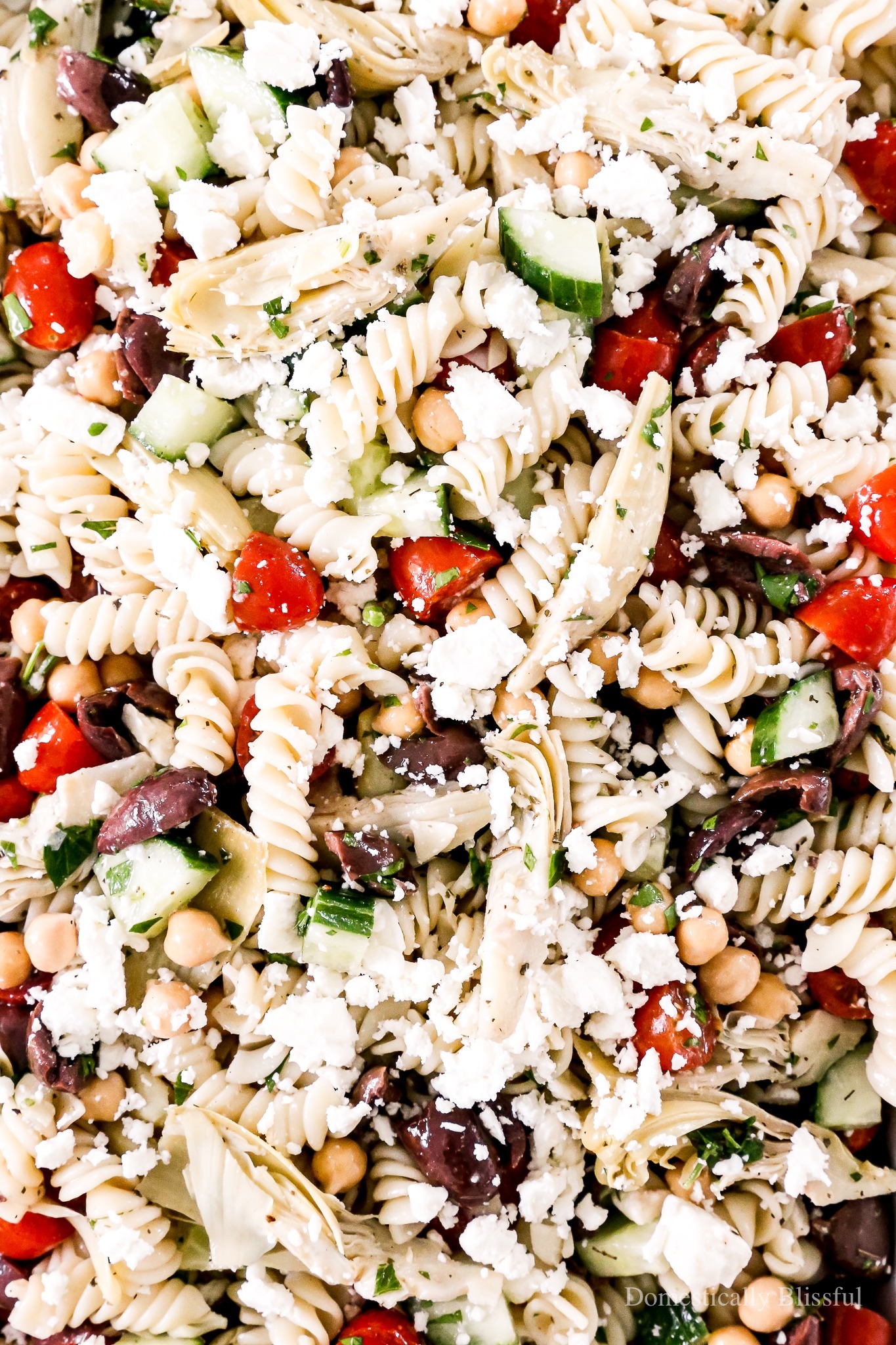An easy Greek Pasta Salad you can make ahead of time this summer for an easy dinner or a flavorful party side dish.
