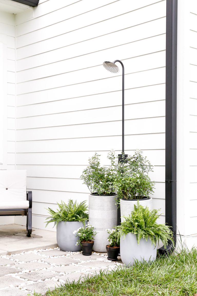 This DIY Outdoor Shower is easy to create using an outdoor faucet (hose bibb).