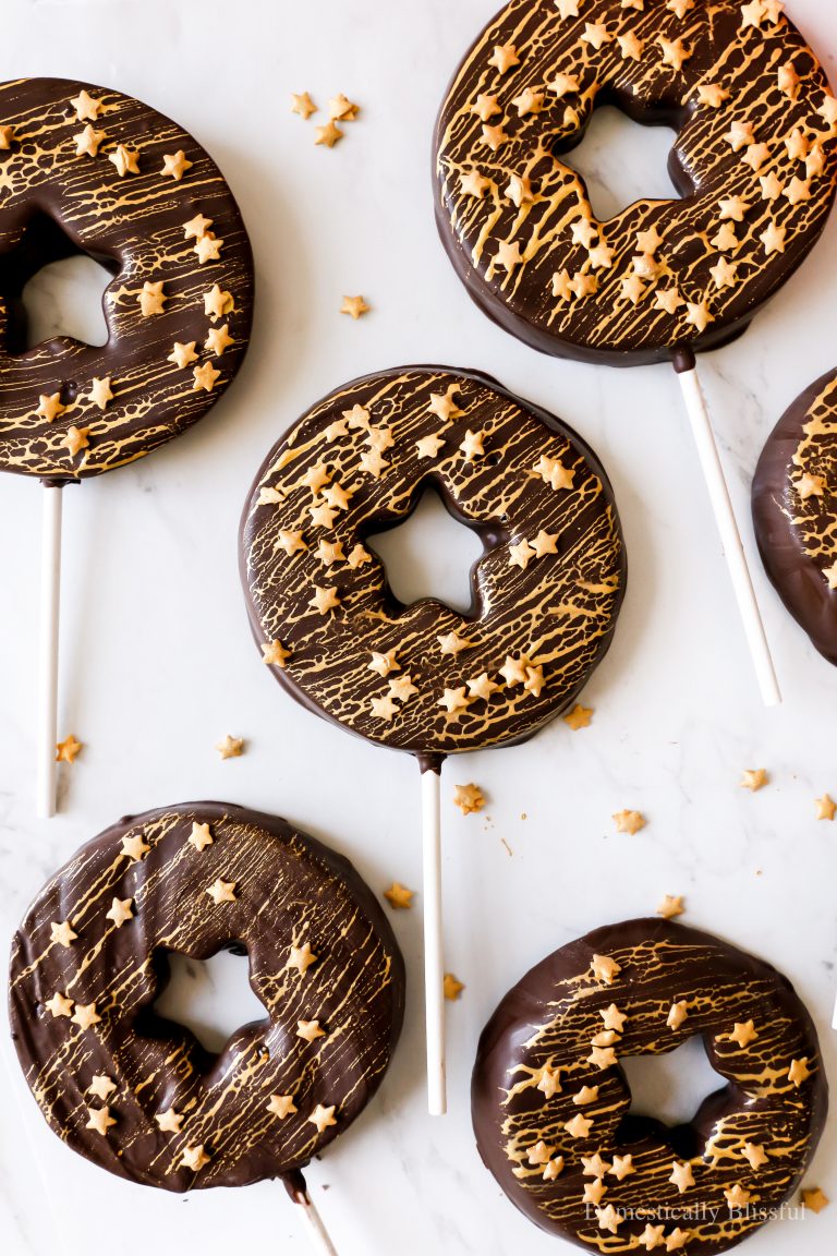 These Star Apple Slices are a fun 4th of July twist on Caramel Apple Slices with star-centered apple slices covered in chocolate and star sprinkles.