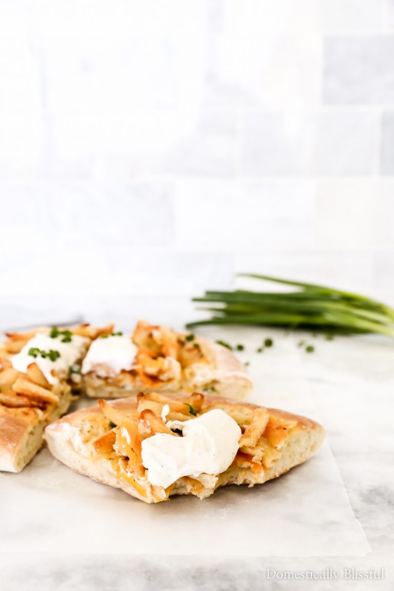 This Loaded Fries Pizza has a seasoned sour cream base & is topped with fries making it a fun twist for pizza night, game nights, or even weeknight dinners.