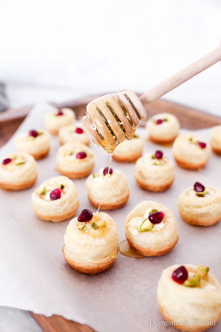 These Honey Goat Cheese Puff Pastry Bites are the perfect finger food appetizer for your next holiday party!