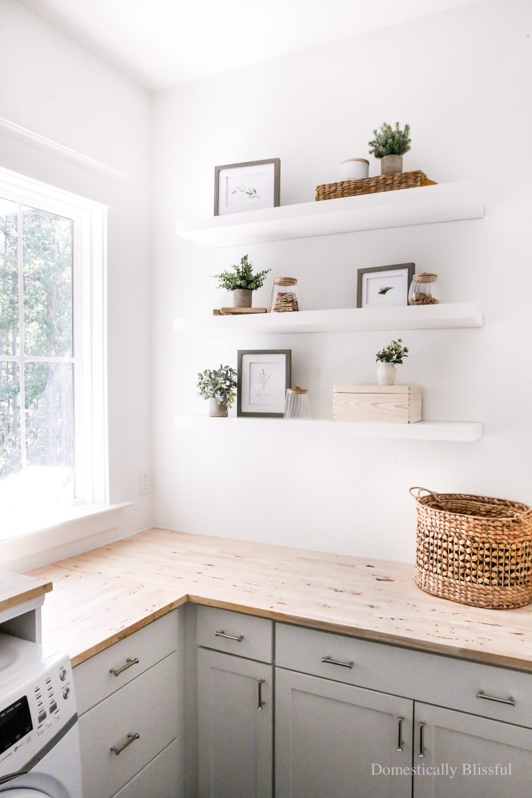 Laundry Room Floating Shelves with simple decor that's decorative and useful.