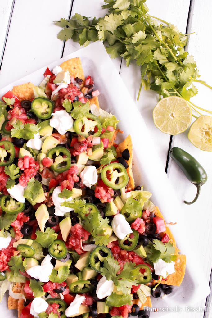 Loaded Vegetable Nachos is a quick & simple vegetarian meal that is filled with flavor & that everyone will love! 