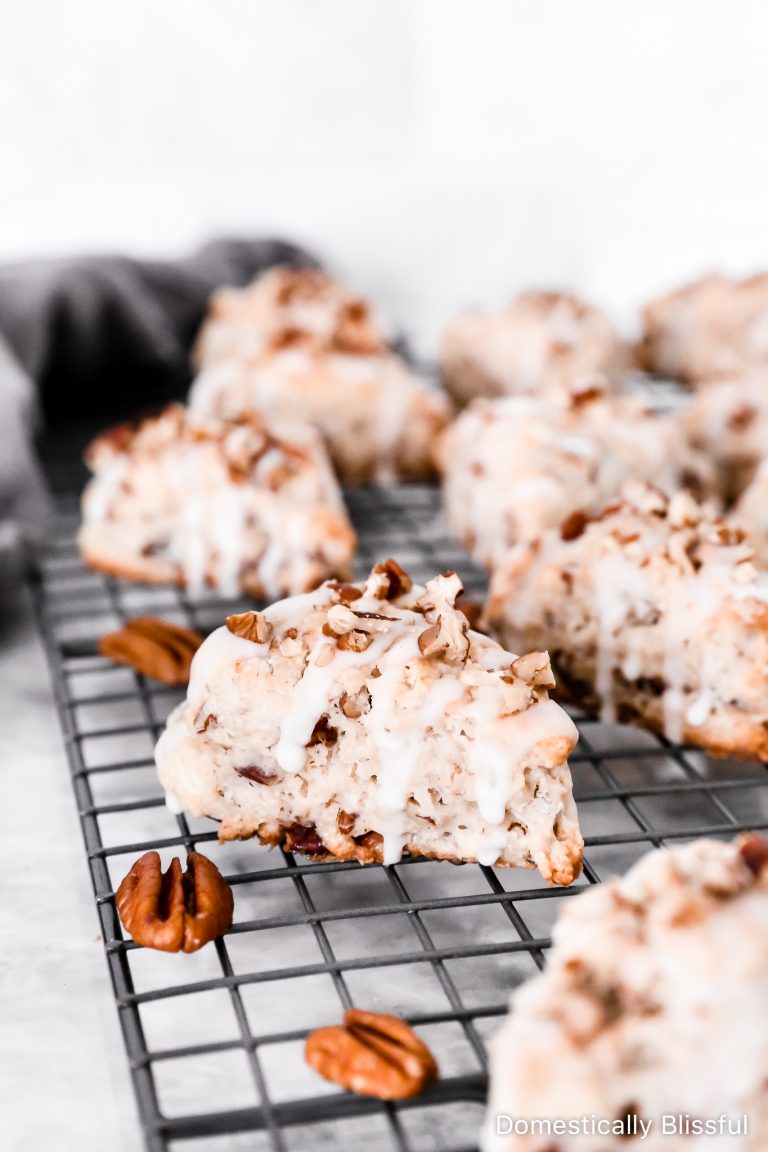 These Maple Pecan Scones are filled with chopped pecans with maple extract and topped with maple icing and more chopped pecans. Plus, a secret ingredient for soft scones!