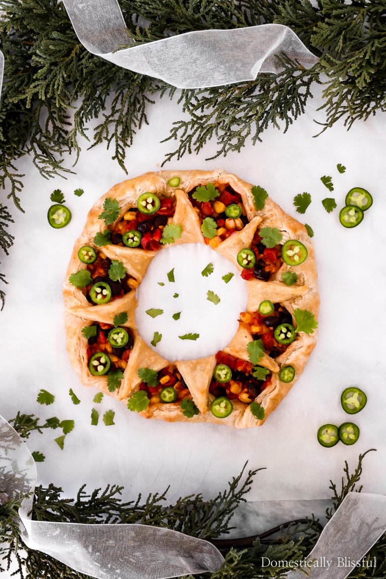 This Black Bean Enchilada Puff Pastry Wreath is the perfect savory holiday appetizer recipe for your next holiday party!