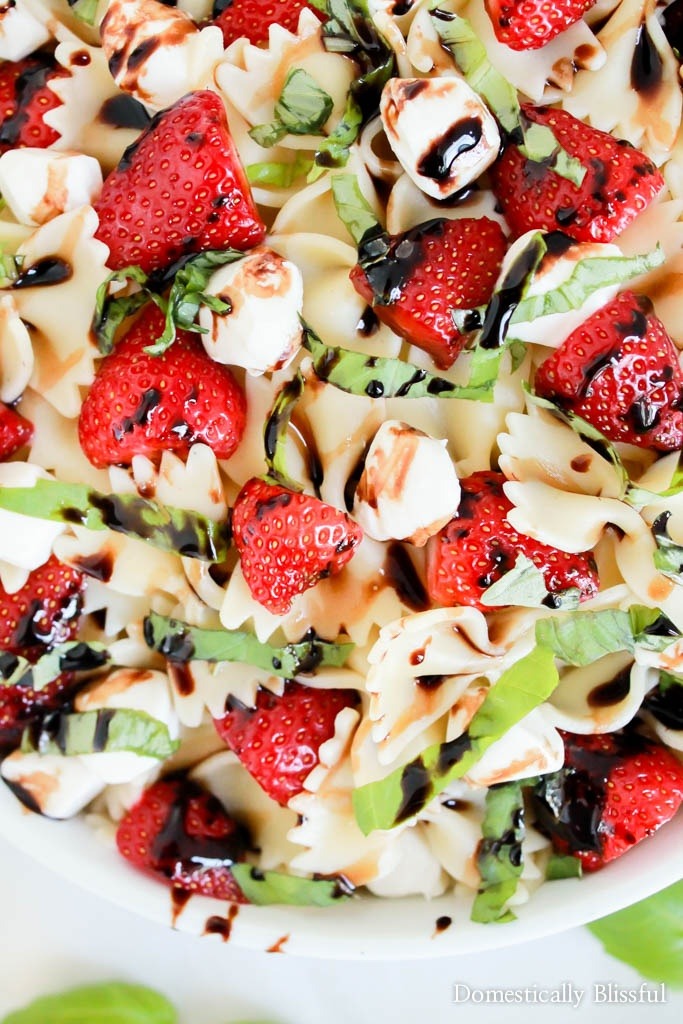 Strawberry Caprese Pasta Salad is overflowing with fresh flavor & is the perfect addition to any summer meal!