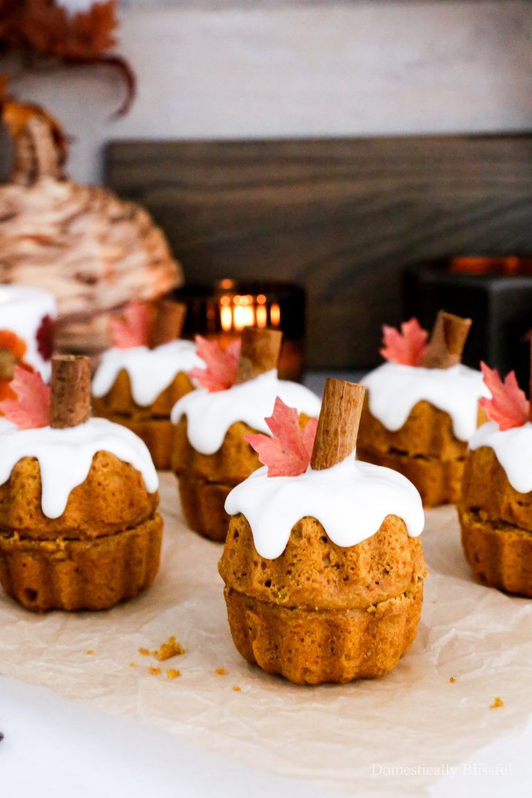 These Mini Bundt Pumpkin Spice Muffins are the perfect fall dessert topped with an edible fall leaf and cinnamon stick making it so fun for fall parties, Friendsgiving, or Thanksgiving.