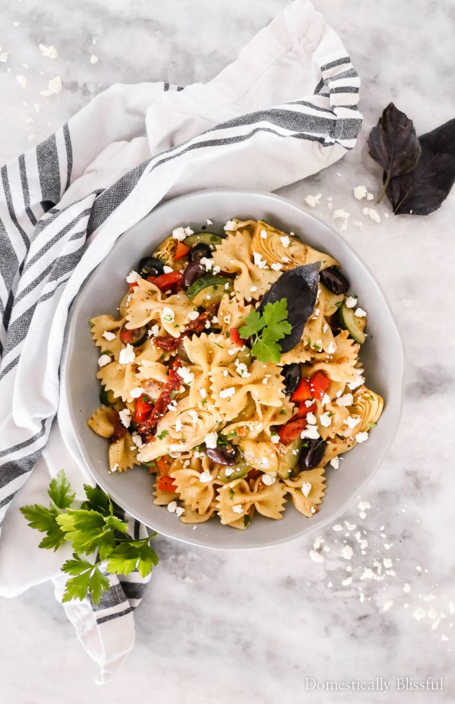 This Quick Mediterranean Pasta can be made in 15 minutes and is filled with a variety of colorful ingredients for a fun vegetarian dinner!