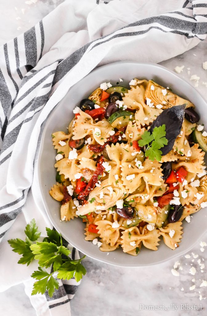 This Quick Mediterranean Pasta can be made in 15 minutes and is filled with a variety of colorful ingredients for a fun vegetarian dinner!