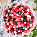This Patriotic Fruit Caprese is a fun way to enjoy your favorite summer fruit and mini mozzarella balls on the 4th of July.