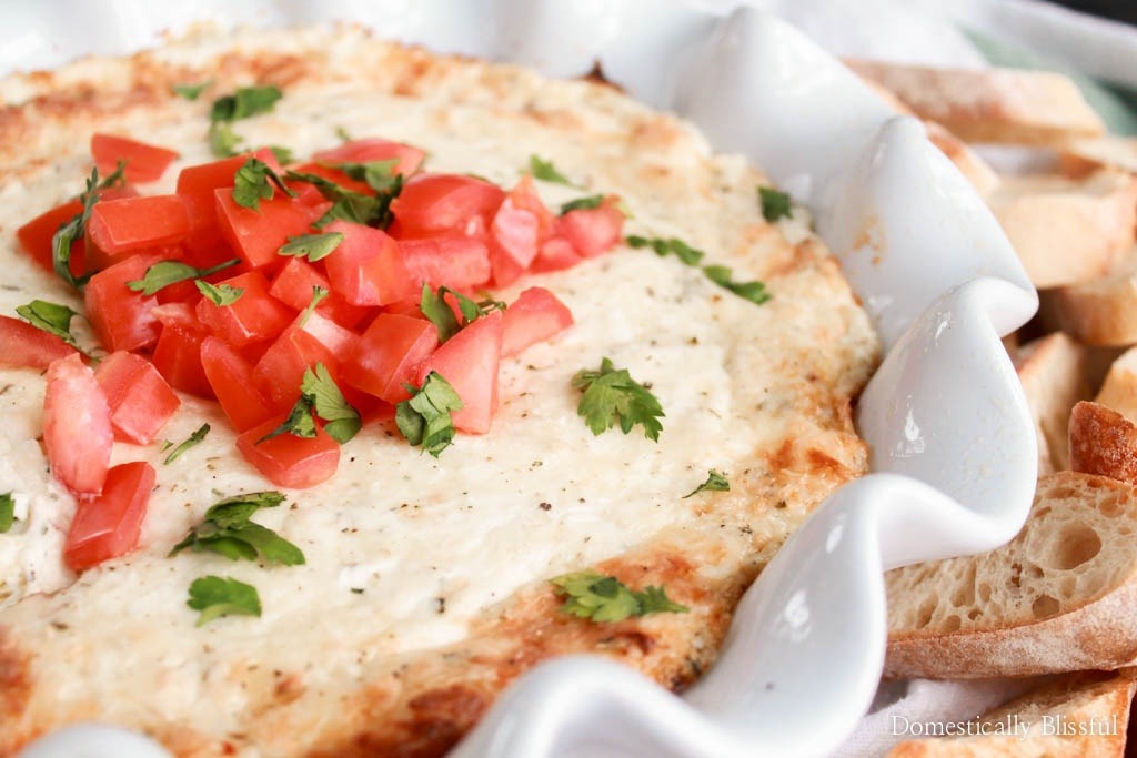 This Smoked Mozzarella Dip is filled with creamy flavors & is the perfect warm appetizer for any party or family gathering!