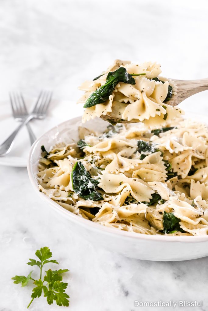 This Spinach Artichoke Pasta is an easy dinner recipe that is quick enough for a weeknight, yet so full of delicious flavors it is perfect for a dinner party. 