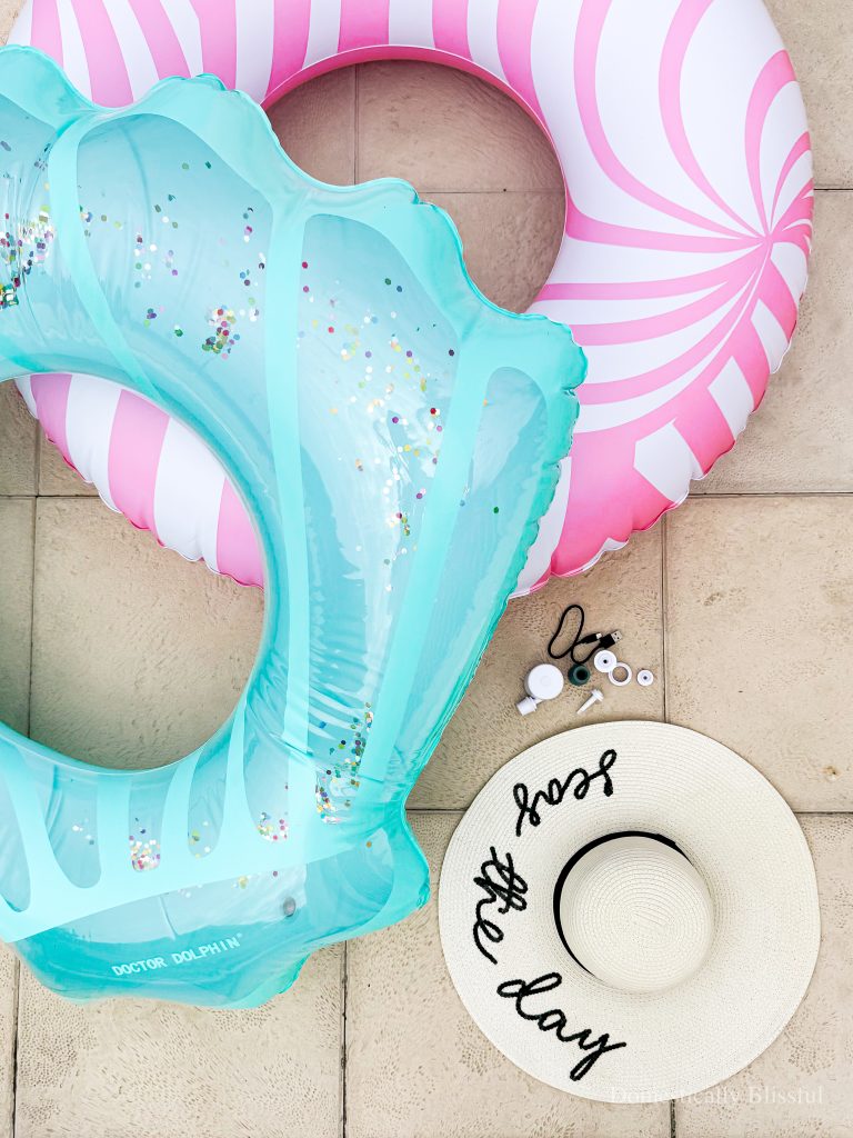 This Tiny Portable Air Pump is the perfect travel accessory for inflating pool rings or an air mattress!