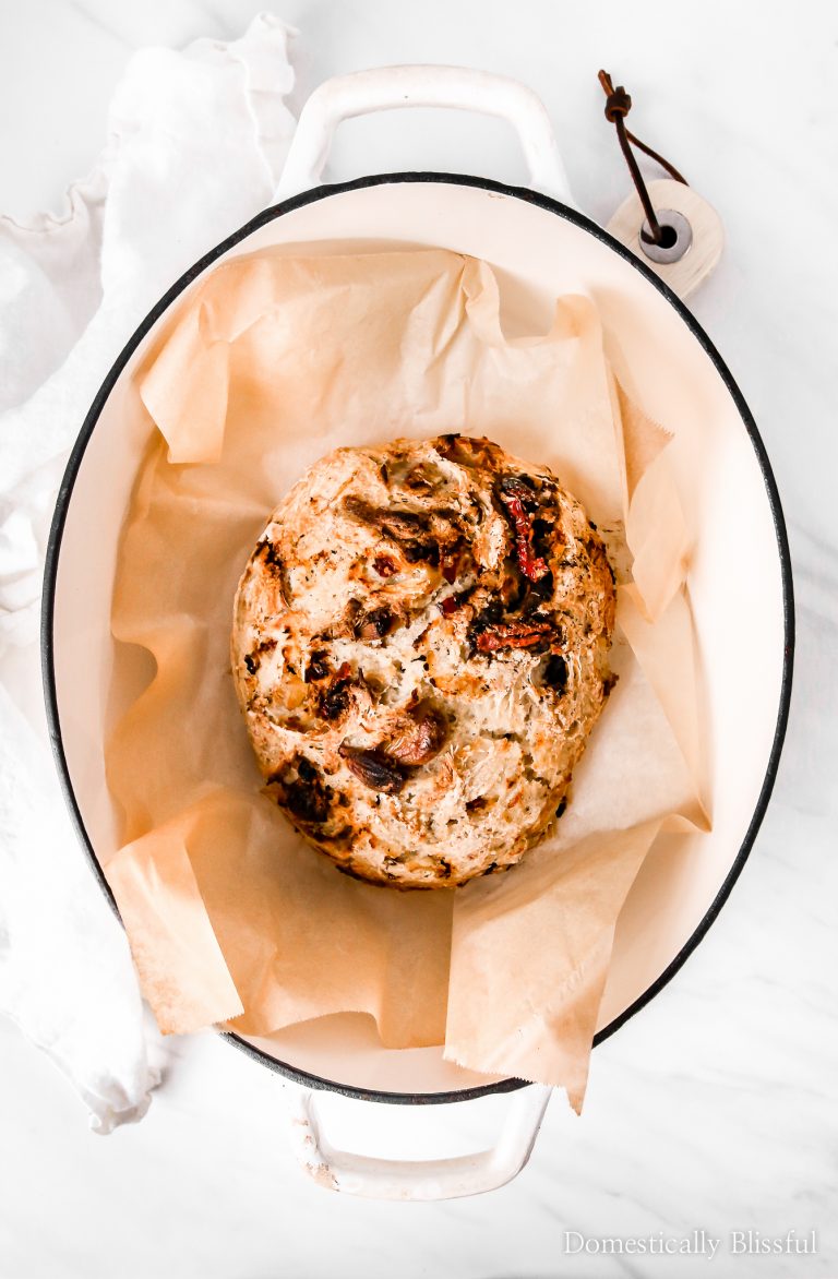 This Sun-Dried Tomato Roasted Garlic No-Knead Bread is crusty on the outside, soft on the inside, & filled with delicious savory flavors.