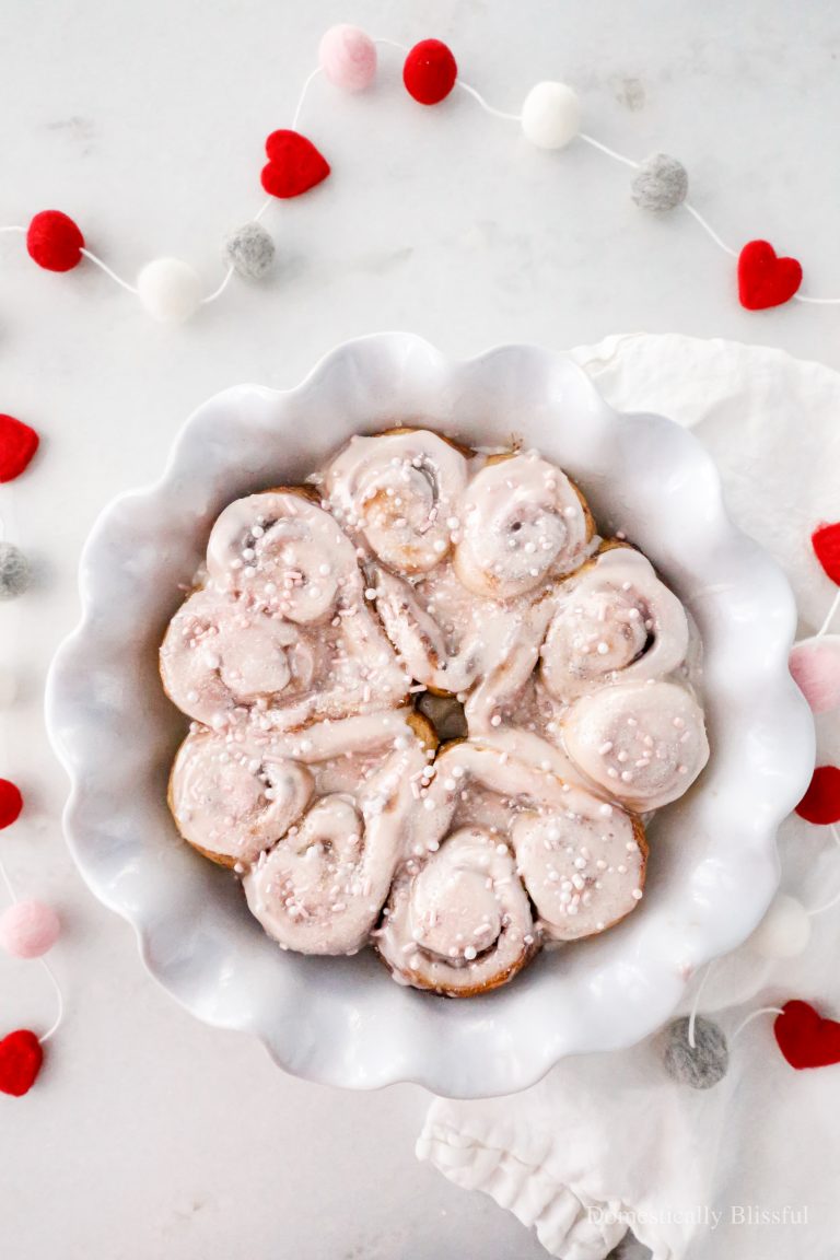 These Heart Cinnamon Rolls are an easy way to turn store-bought cinnamon rolls into a fun family Valentine's Day breakfast or to bring to a Galentine's Day Brunch.