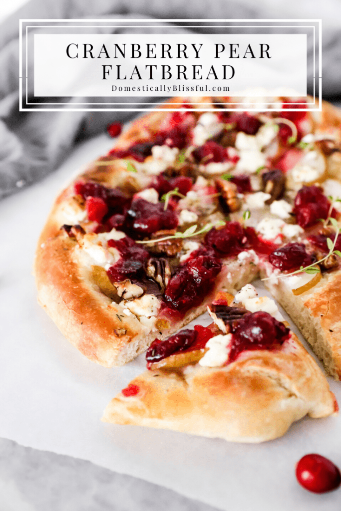 This Cranberry Pear Flatbread is topped with goat cheese, fresh pear, cranberry sauce, and pecans, making it a delicious Christmas appetizer or Thanksgiving leftover recipe.