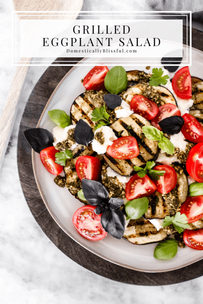 This Grilled Eggplant Salad is marinated, grilled, and topped with whipped ricotta, pesto, quartered tomatoes, and fresh herbs.