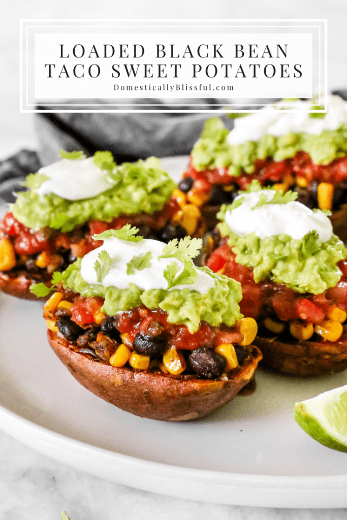 These Loaded Black Bean Taco Sweet Potatoes are covered in seasoned black beans and corn and topped with cheese, sour cream, salsa, guacamole, cilantro, and a squeeze of lime.