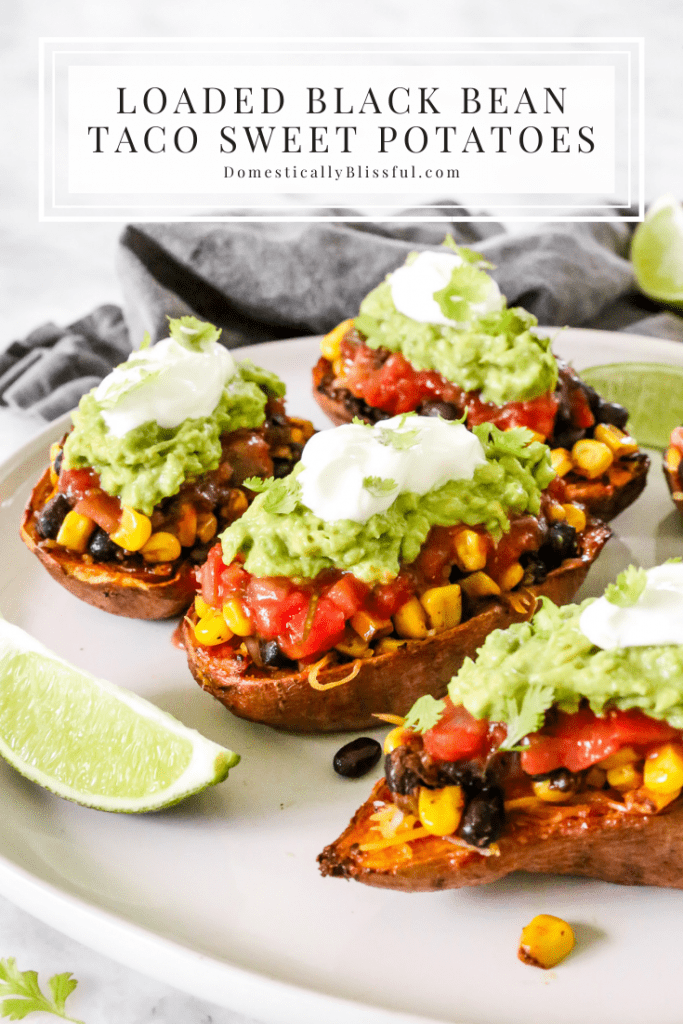 These Loaded Black Bean Taco Sweet Potatoes are covered in seasoned black beans and corn and topped with cheese, sour cream, salsa, guacamole, cilantro, and a squeeze of lime.